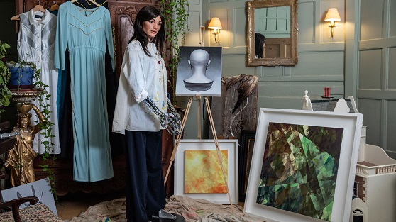 Ai-da and her abstract paintings.