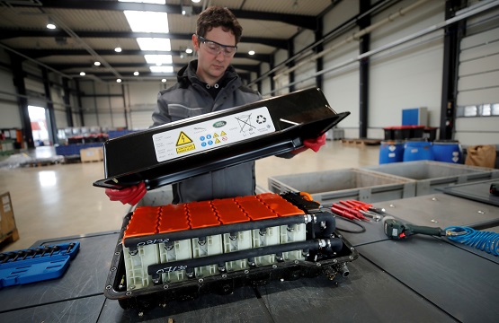 FILE PHOTO: A used Lithium-ion car battery is opened before its dismantling by an employee of the German recycling firm Accurec in Krefeld, Germany, November 16, 2017. Picture taken November 16, 2017. REUTERS/Wolfgang Rattay.