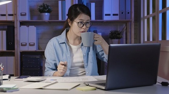 Women operating Laptop.
